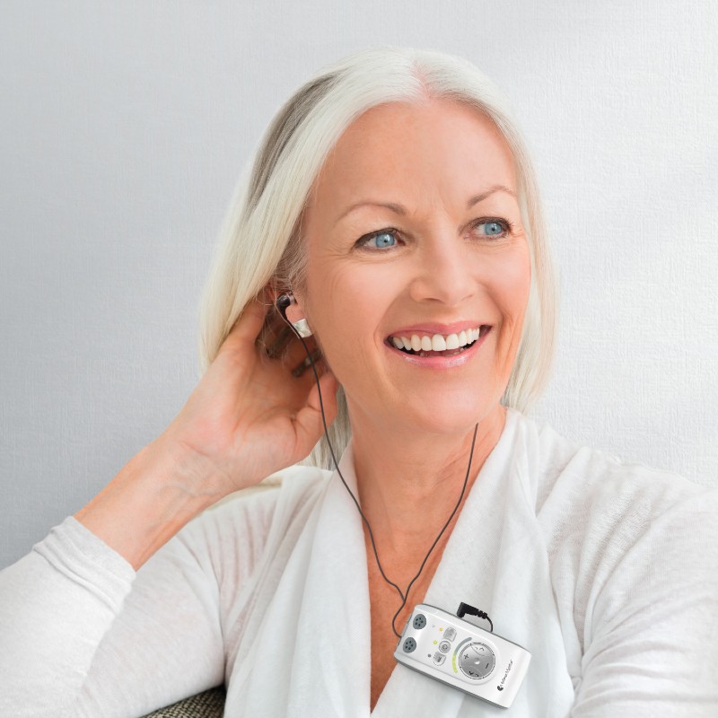 Woman Wearing the Bellman Audio Mino Amplifier