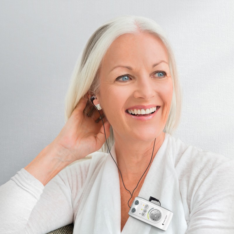 Woman Wearing the Bellman Audio Mino Amplifier 